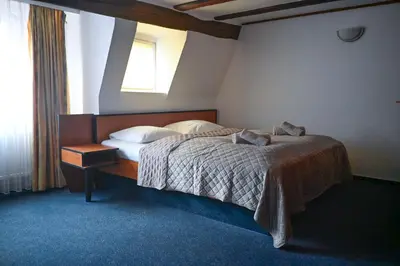 Ein Bett oder Betten in einem Zimmer der Unterkunft Steingarten Hotel
