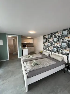 Ein Bett oder Betten in einem Zimmer der Unterkunft modernes Monteurzimmer mit zwei Einzelbetten