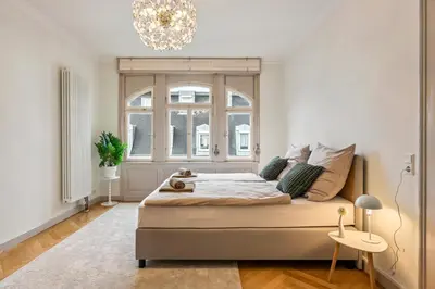 Ein Bett oder Betten in einem Zimmer der Unterkunft LubuNest l Familien und Gruppen, Zentral, Altbau
