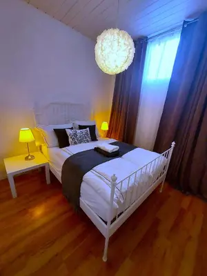 Ein Bett oder Betten in einem Zimmer der Unterkunft Apartmenthaus Schlosspark