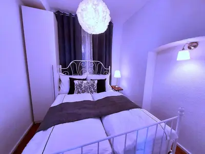 Ein Bett oder Betten in einem Zimmer der Unterkunft Apartmenthaus Schlosspark