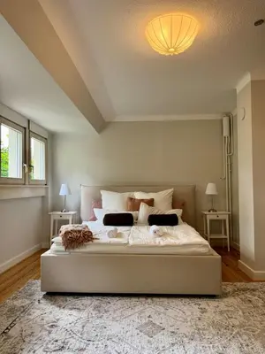 Ein Bett oder Betten in einem Zimmer der Unterkunft Boutique Apartment Villa Jaenisch