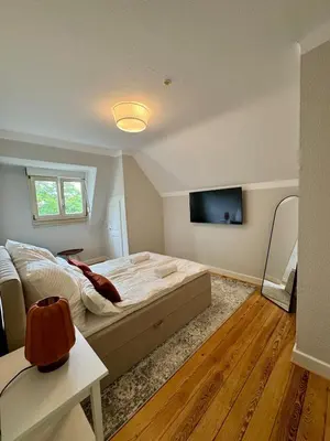 Ein Bett oder Betten in einem Zimmer der Unterkunft Boutique Apartment Villa Jaenisch