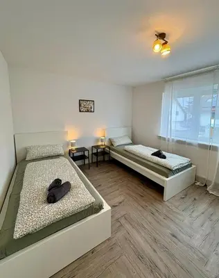Ein Bett oder Betten in einem Zimmer der Unterkunft Modern apartment 2 for fitters with parking space in Lampertheim