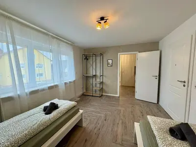 Ein Bett oder Betten in einem Zimmer der Unterkunft Modern apartment 2 for fitters with parking space in Lampertheim