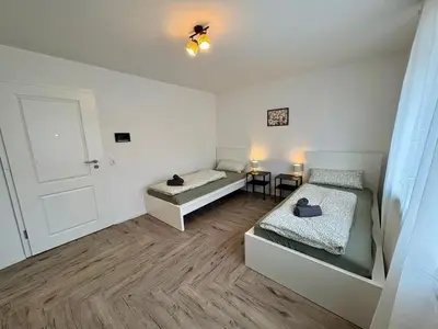 Ein Bett oder Betten in einem Zimmer der Unterkunft Modern apartment 2 for fitters with parking space in Lampertheim