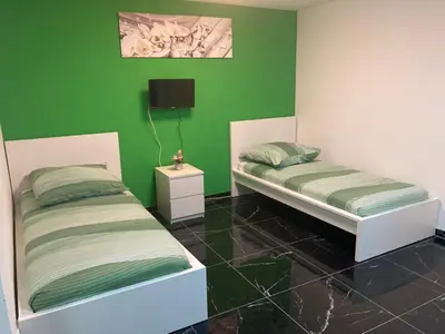 Ein Bett oder Betten in einem Zimmer der Unterkunft SjFewo