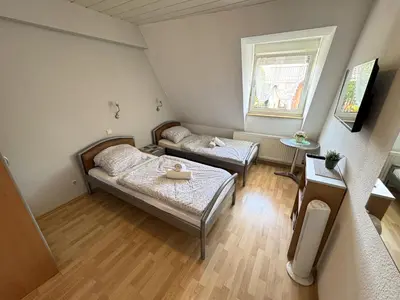 Ein Bett oder Betten in einem Zimmer der Unterkunft Family and Friends Worms