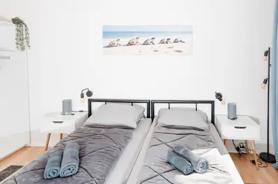 Ein Bett oder Betten in einem Zimmer der Unterkunft Lichtdurchflutetes City-Apartment mit 5 Betten