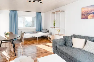 Ein Bett oder Betten in einem Zimmer der Unterkunft Lichtdurchflutetes City-Apartment mit 5 Betten