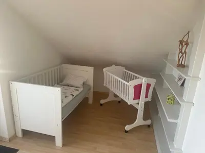 Ein Bett oder Betten in einem Zimmer der Unterkunft Tinas Ferienwohnung Bietigheim Baden