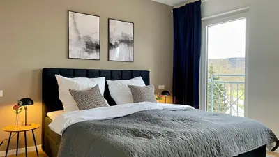 Ein Bett oder Betten in einem Zimmer der Unterkunft Design Apartment Gruppen & Business 10 min zu SAP