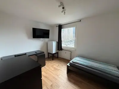 Ein Bett oder Betten in einem Zimmer der Unterkunft 3-Zimmer Wohnung mit Balkon am Betze