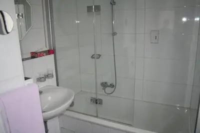 Ein Badezimmer in der Unterkunft Hotel Regina