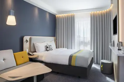Ein Bett oder Betten in einem Zimmer der Unterkunft Holiday Inn Express Karlsruhe - City Park by IHG