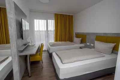 Ein Bett oder Betten in einem Zimmer der Unterkunft Seehotel Forst
