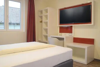Ein Bett oder Betten in einem Zimmer der Unterkunft Hotel Arts