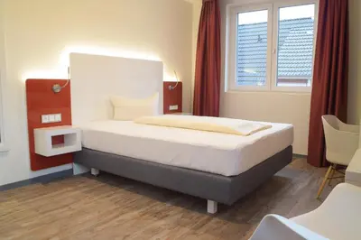 Ein Bett oder Betten in einem Zimmer der Unterkunft Hotel Arts