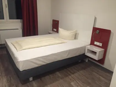 Ein Bett oder Betten in einem Zimmer der Unterkunft Hotel Arts