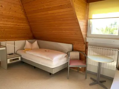 Ein Bett oder Betten in einem Zimmer der Unterkunft Gästehaus an der Rheinbrücke