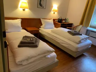Ein Bett oder Betten in einem Zimmer der Unterkunft Gästehaus an der Rheinbrücke