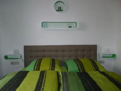 Ein Bett oder Betten in einem Zimmer der Unterkunft Gästehaus Bacchus