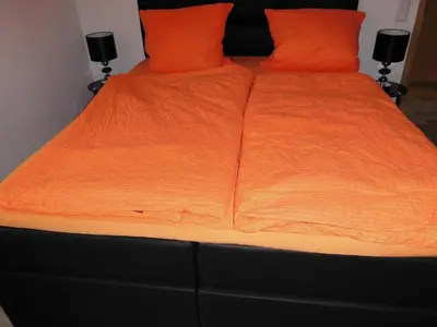 Ein Bett oder Betten in einem Zimmer der Unterkunft Ferienwohnung Spatzennest