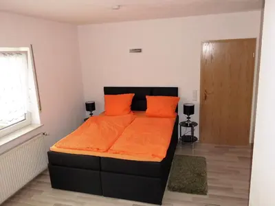 Ein Bett oder Betten in einem Zimmer der Unterkunft Ferienwohnung Spatzennest