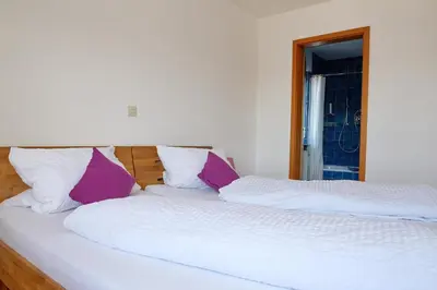 Ein Bett oder Betten in einem Zimmer der Unterkunft Ferienwohnungen Schwarzwaldpforte