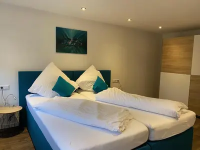 Ein Bett oder Betten in einem Zimmer der Unterkunft Ferienwohnungen Schwarzwaldpforte