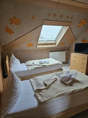 Ein Bett oder Betten in einem Zimmer der Unterkunft Hotel Tenne
