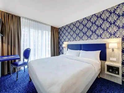Ein Bett oder Betten in einem Zimmer der Unterkunft ibis Styles Rastatt Baden-Baden