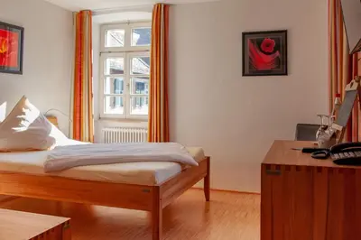 Ein Bett oder Betten in einem Zimmer der Unterkunft Hotel & Café Ritter von Böhl