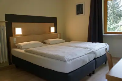 Ein Bett oder Betten in einem Zimmer der Unterkunft Kloster Neustadt