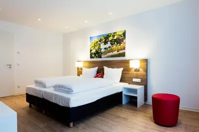 Ein Bett oder Betten in einem Zimmer der Unterkunft SCHLAFGUT Domhof erleben