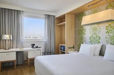 Ein Bett oder Betten in einem Zimmer der Unterkunft NH Ludwigsburg