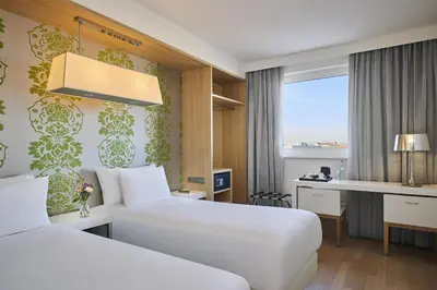 Ein Bett oder Betten in einem Zimmer der Unterkunft NH Ludwigsburg