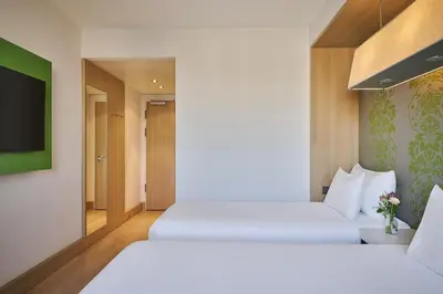 Ein Bett oder Betten in einem Zimmer der Unterkunft NH Ludwigsburg