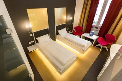 Ein Bett oder Betten in einem Zimmer der Unterkunft Hotel Sinsheim