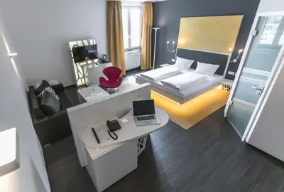 Ein Bett oder Betten in einem Zimmer der Unterkunft Hotel Sinsheim