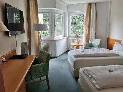 Ein Bett oder Betten in einem Zimmer der Unterkunft Hotel Schober