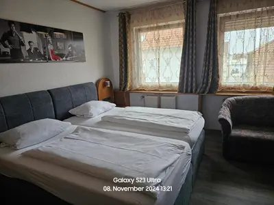 Ein Bett oder Betten in einem Zimmer der Unterkunft Landhotel Margaretenhof