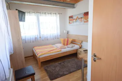 Ein Bett oder Betten in einem Zimmer der Unterkunft Gästehaus Neckarsulm