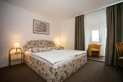 Ein Bett oder Betten in einem Zimmer der Unterkunft Hotel Wagner Am Marktplatz