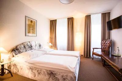 Ein Bett oder Betten in einem Zimmer der Unterkunft Hotel Wagner Am Marktplatz