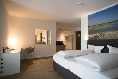 Ein Bett oder Betten in einem Zimmer der Unterkunft Hotel absolute