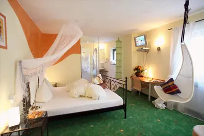 Ein Bett oder Betten in einem Zimmer der Unterkunft Hotel Am Hirschhorn - Wellness - Spa - and more