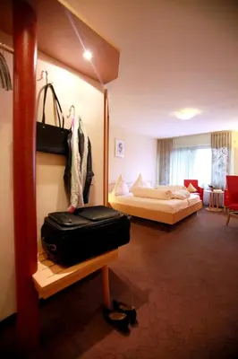 Ein Bett oder Betten in einem Zimmer der Unterkunft Hotel Am Hirschhorn - Wellness - Spa - and more