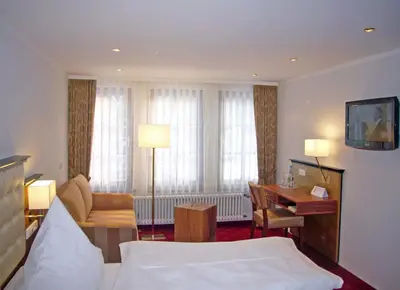 Ein Bett oder Betten in einem Zimmer der Unterkunft Naturhotel Rügers Forstgut