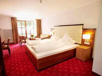 Ein Bett oder Betten in einem Zimmer der Unterkunft Naturhotel Rügers Forstgut